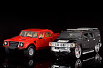 The Lamborghini LM002 next to the more modern Hummer H2