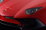 Open grilles and detailed headlights on this Rosso Bia Superveloce