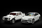 The white over red Lamborghini Urus next to the LM002 in a similar color combination